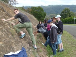 Students inspect an outcrop of Ashfield Shale