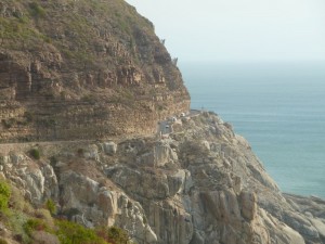 Chapman's Peak Drive south of Cape Town, South Africa. Road sits on grey granite pluton. Sedimentary strata sit alongside and above the road.